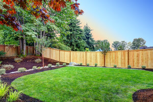 Wooden residential privacy fence around yard